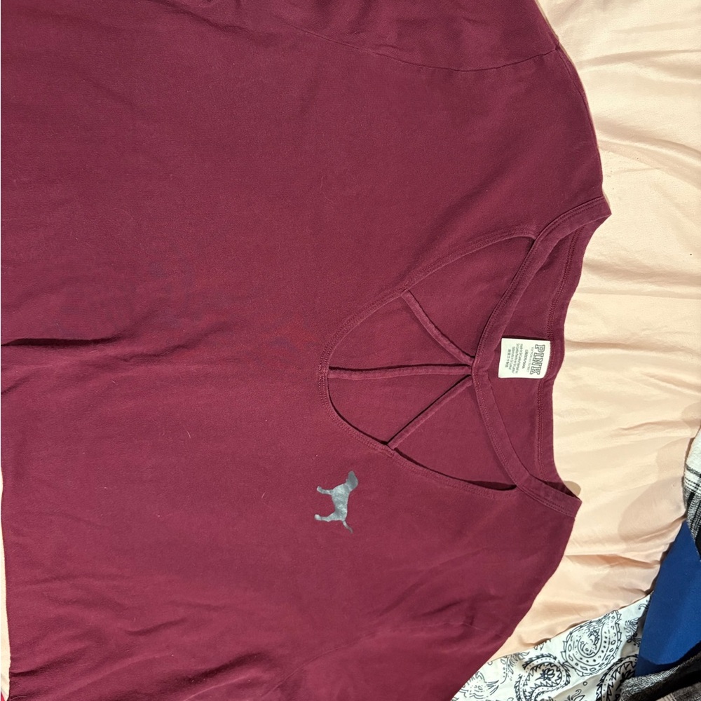 Maroon T-Shirt with Pink Logo.